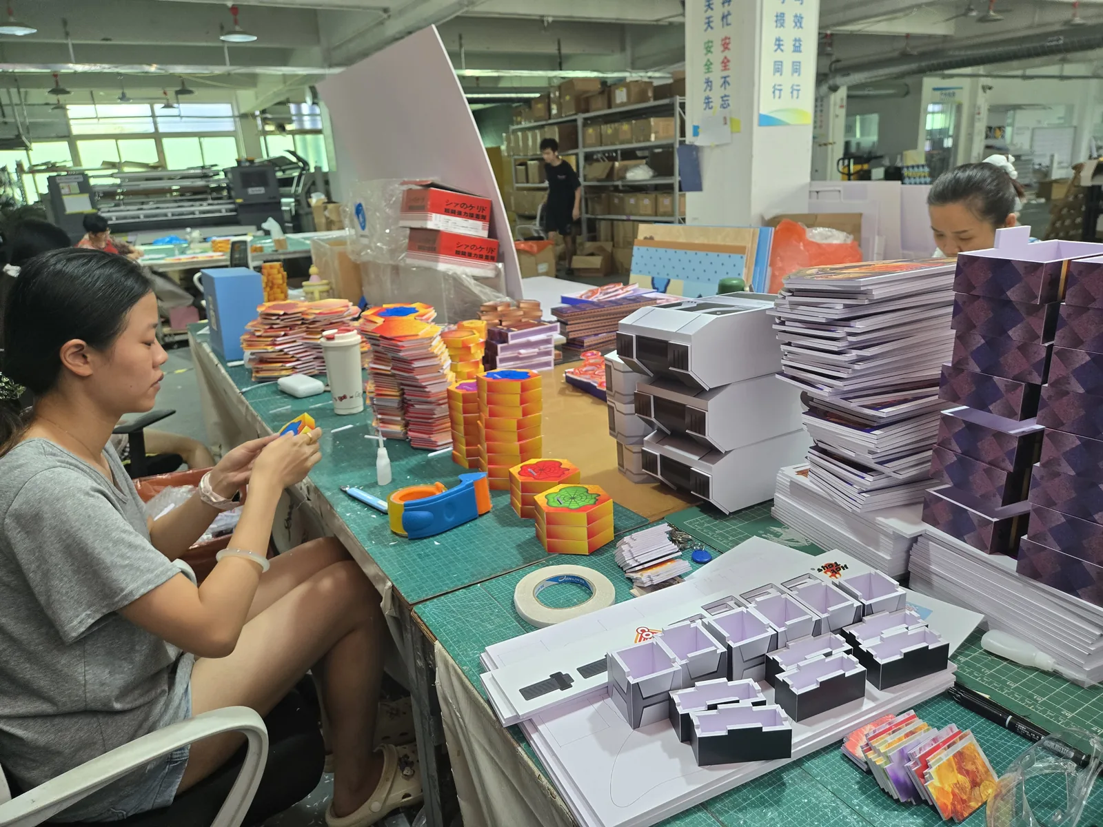 Factory team assembling store materials for a global brand
