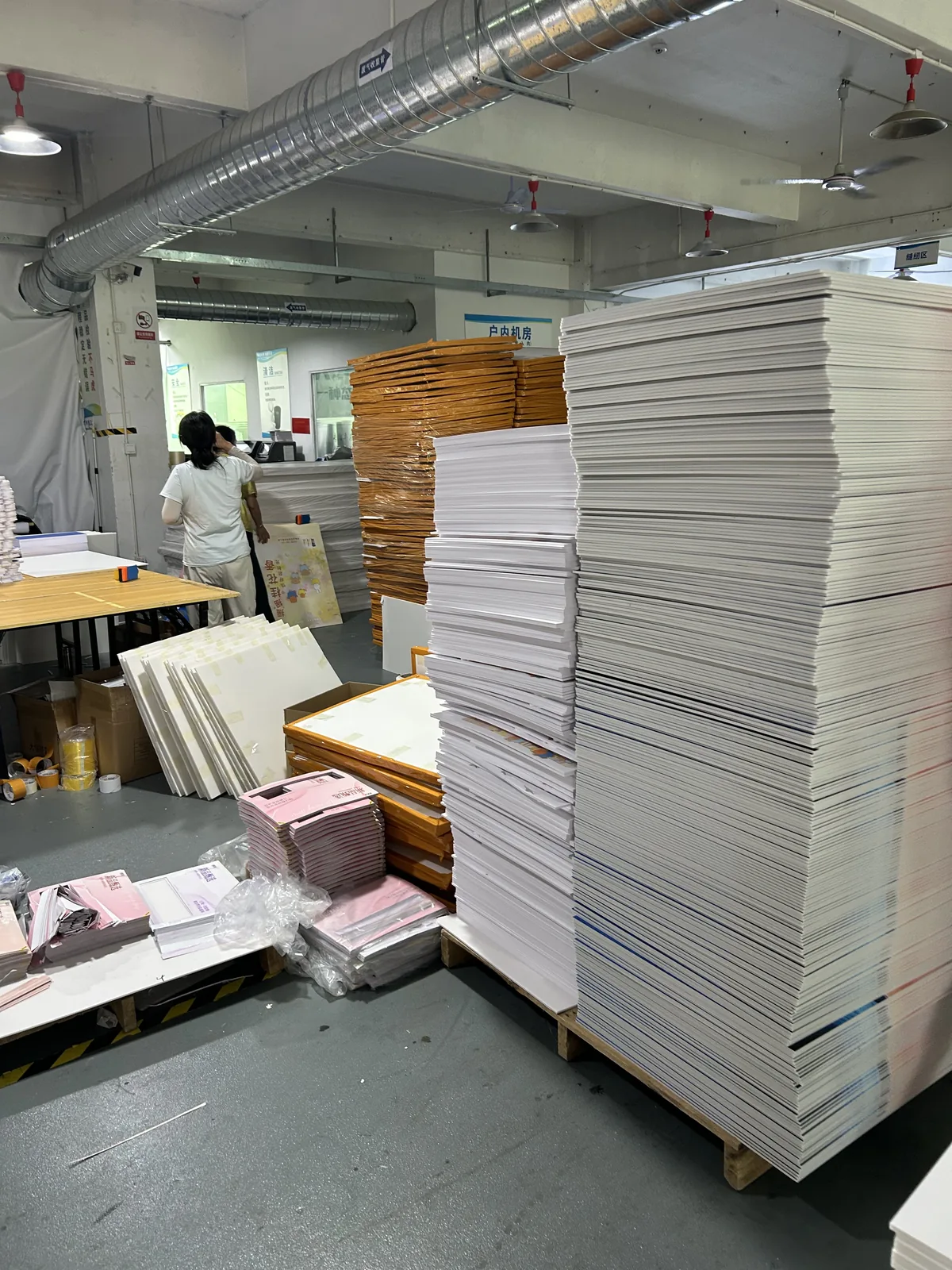 White flat materials awaiting sorting in the factory.