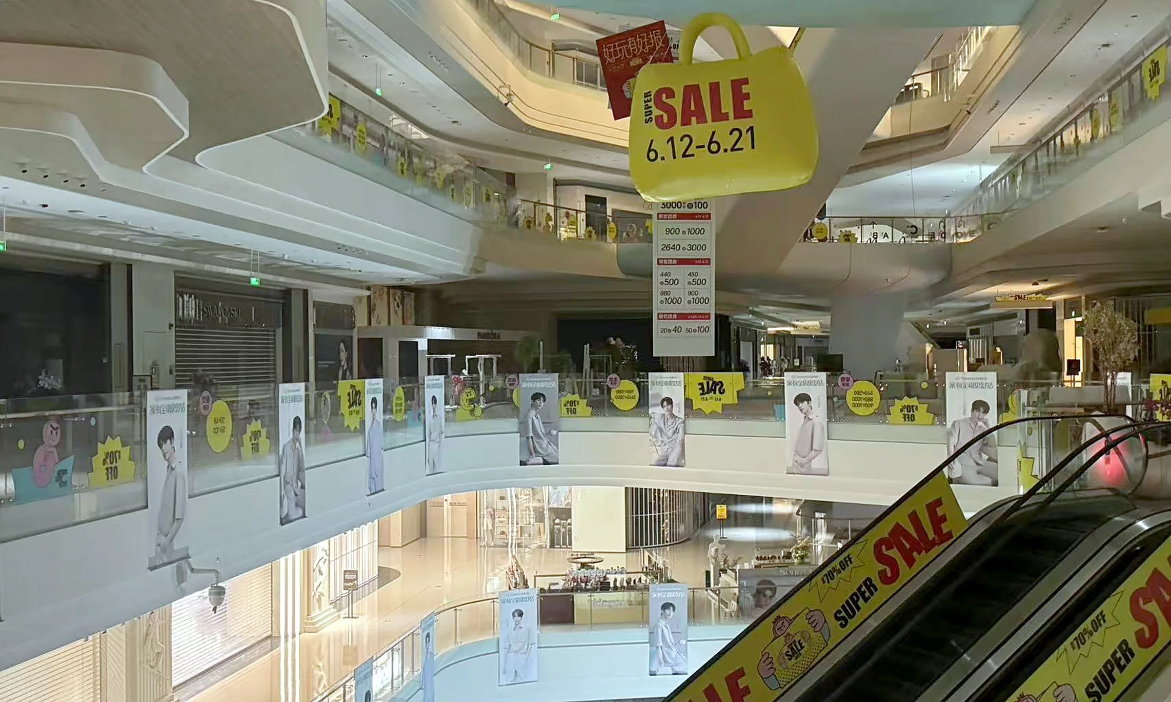 Hanging atrium banners and railing graphics in a shopping mall