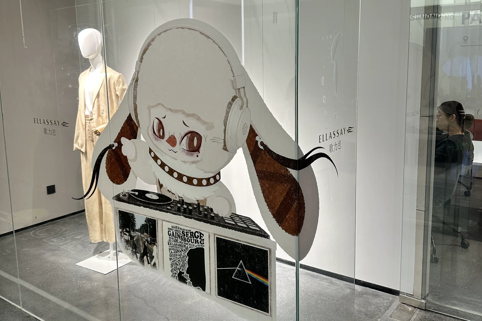 Printed character graphics applied to a retail shop window